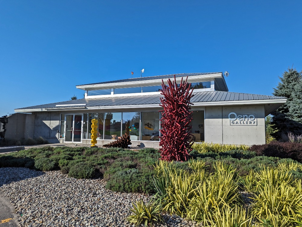 Exterior of the Oeno Gallery at Huff Estate with garden in front.