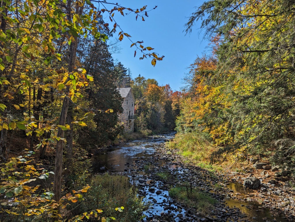 Mill of Kintail Conservation Area in Almonte with fall foliage around it