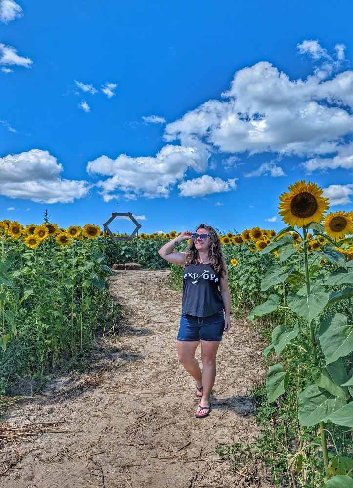me walking through sunflower field at Robintide Farms