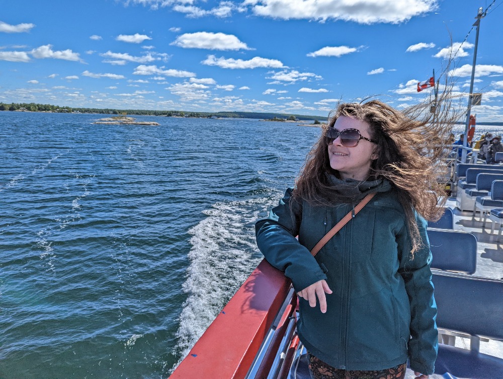 Me standing on the top deck of the Georgian Legacy boat  tour of Georgian Bay