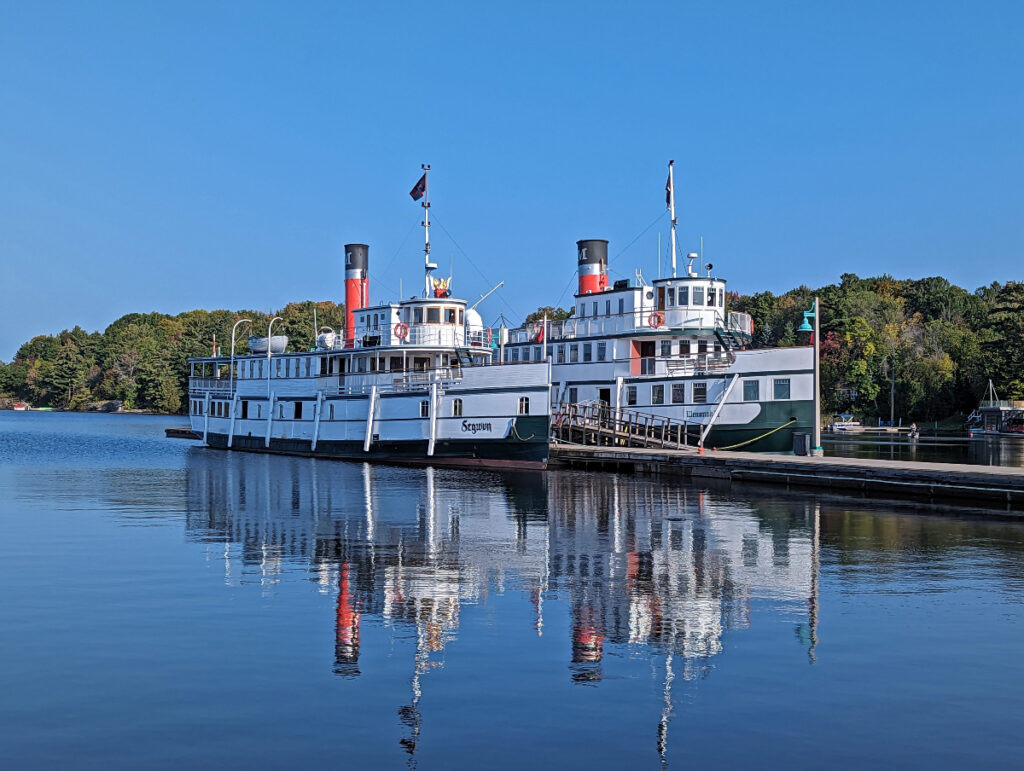 The Muskoka Steamships, Segwun and Wennona II, docked in the bay along Muskoka Wharf in Gravenhurst