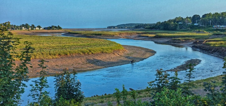 Views of the tides coming in at Tidal Park in Parrsboro Nova Scotia. There's a winding waterway leading off into the distance