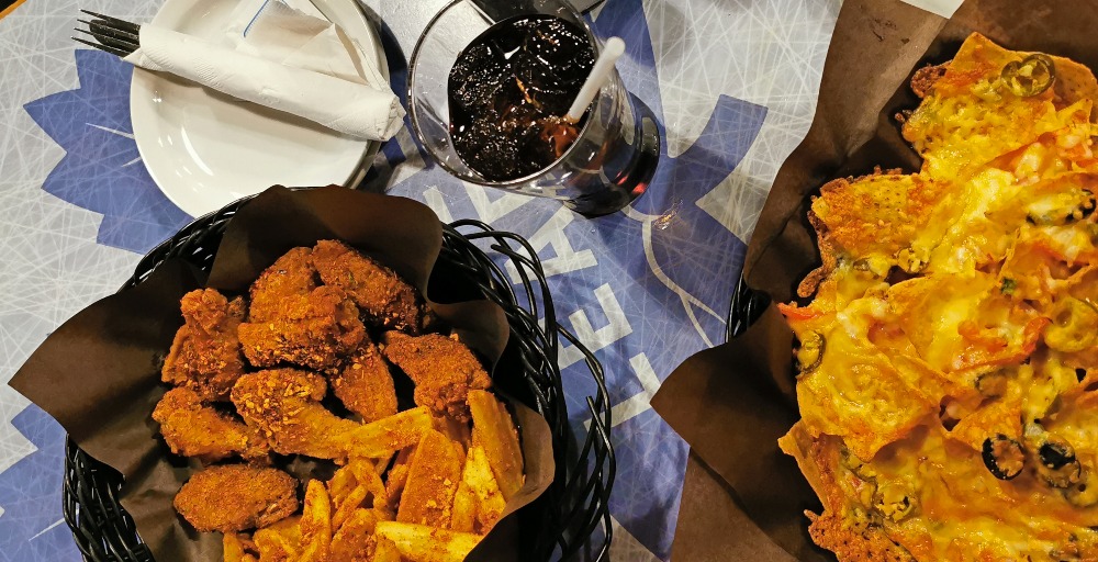 Bowl of wings and plate of nachos at the Lockeroom pub in Barrie