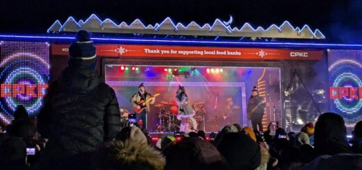 CP Holiday Train with band playing and crowds out front