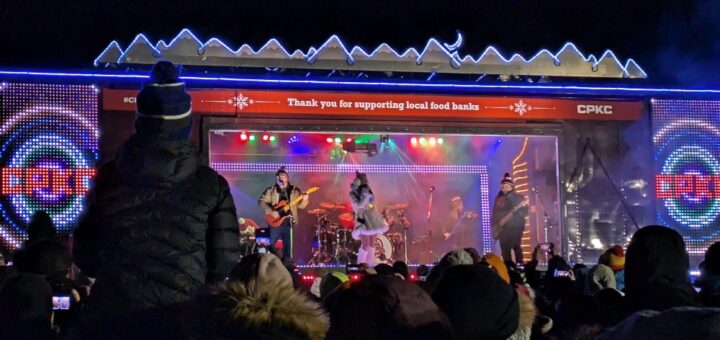 CP Holiday Train with band playing and crowds out front