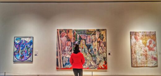 Me standing in front of a wall of art at the Robert McLaughlin Gallery in Oshawa