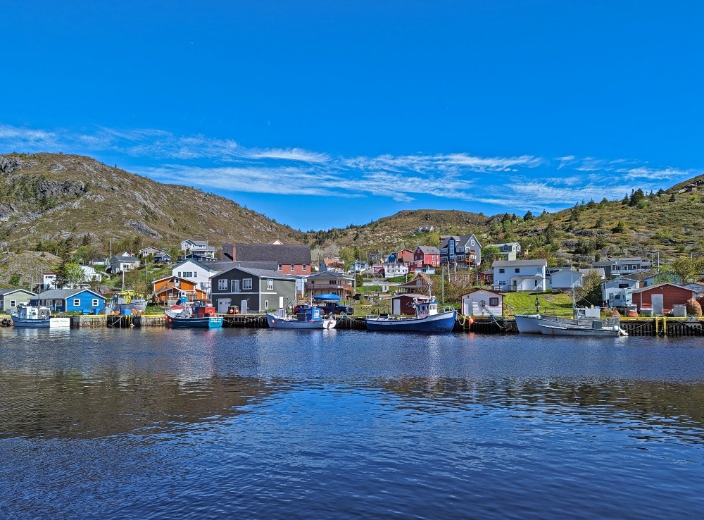 Colourful buildings and boats along Petty Harbour Newfoundland