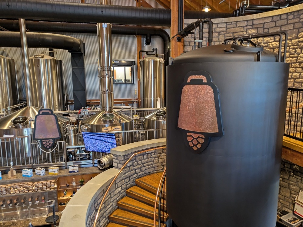 Tanks and set of stairs inside Cowbell Brewery
