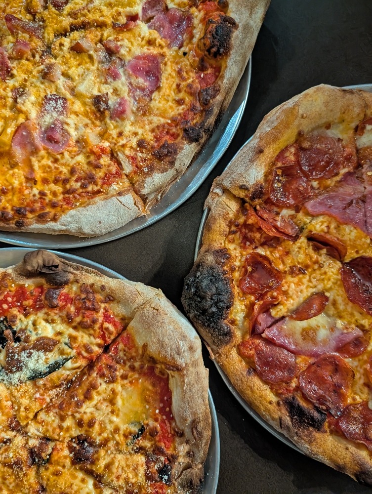 Cross section of three different pizzas at Capra Toro