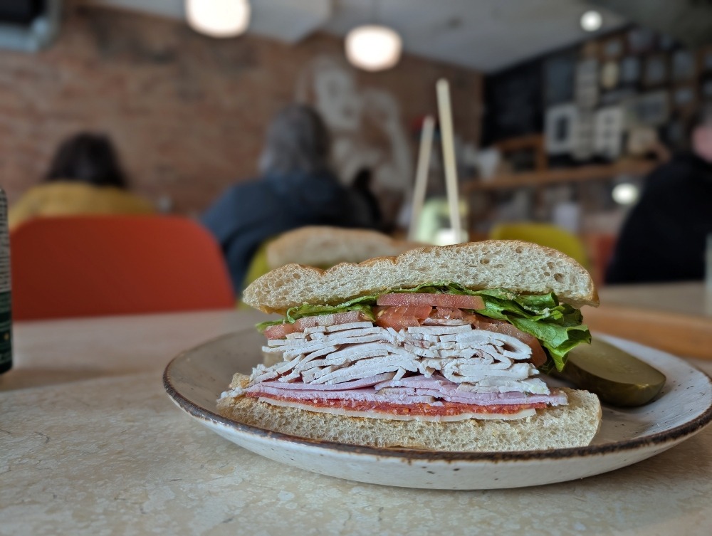 Italian club sandwich, open faced on a plate, at Sam's Place