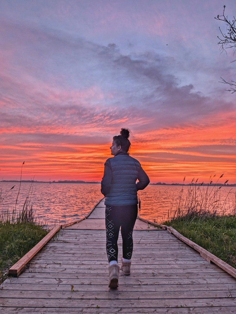 me walking on dock at Rondeau Provincial Park during sunset