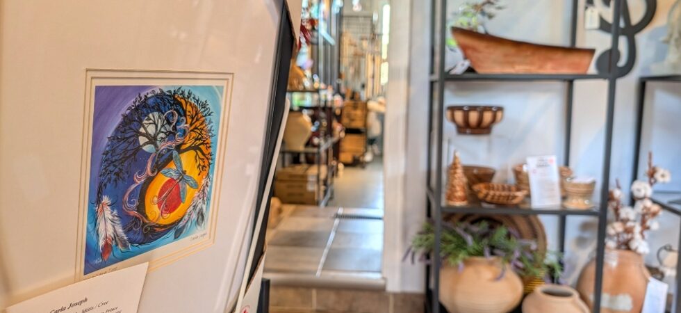 Close up of piece of art with other decor items in the background at Hamilton's of Pelham gift shop