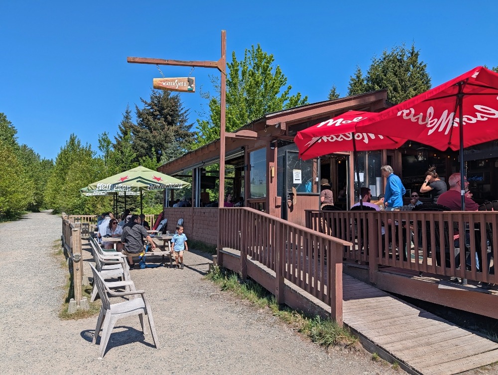 Watershed Grill in Squamish. With umbrellas covering patio tables