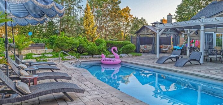 pool area with loungers at the Old Mill Manor