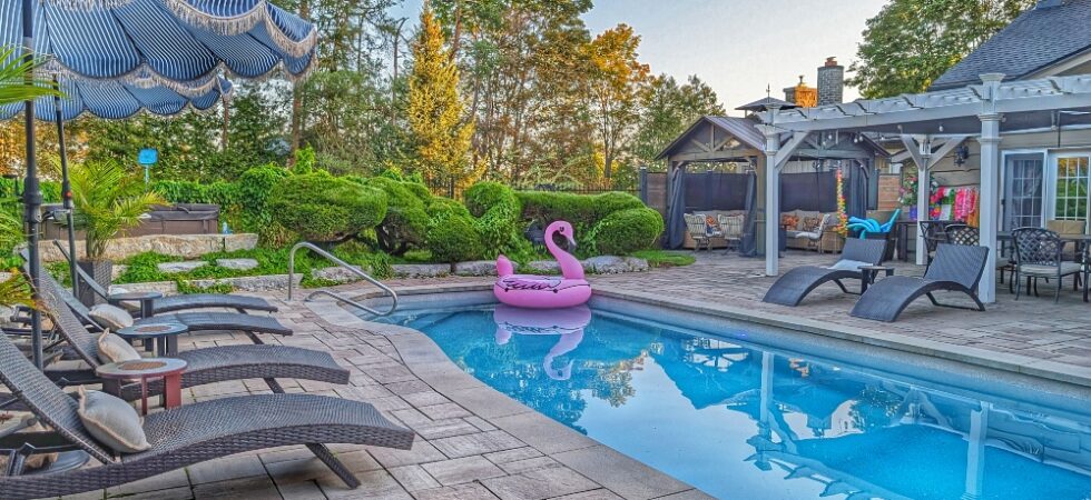 pool area with loungers at the Old Mill Manor