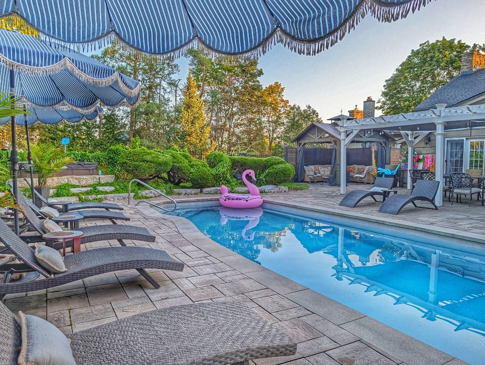pool area with loungers at the Old Mill Manor