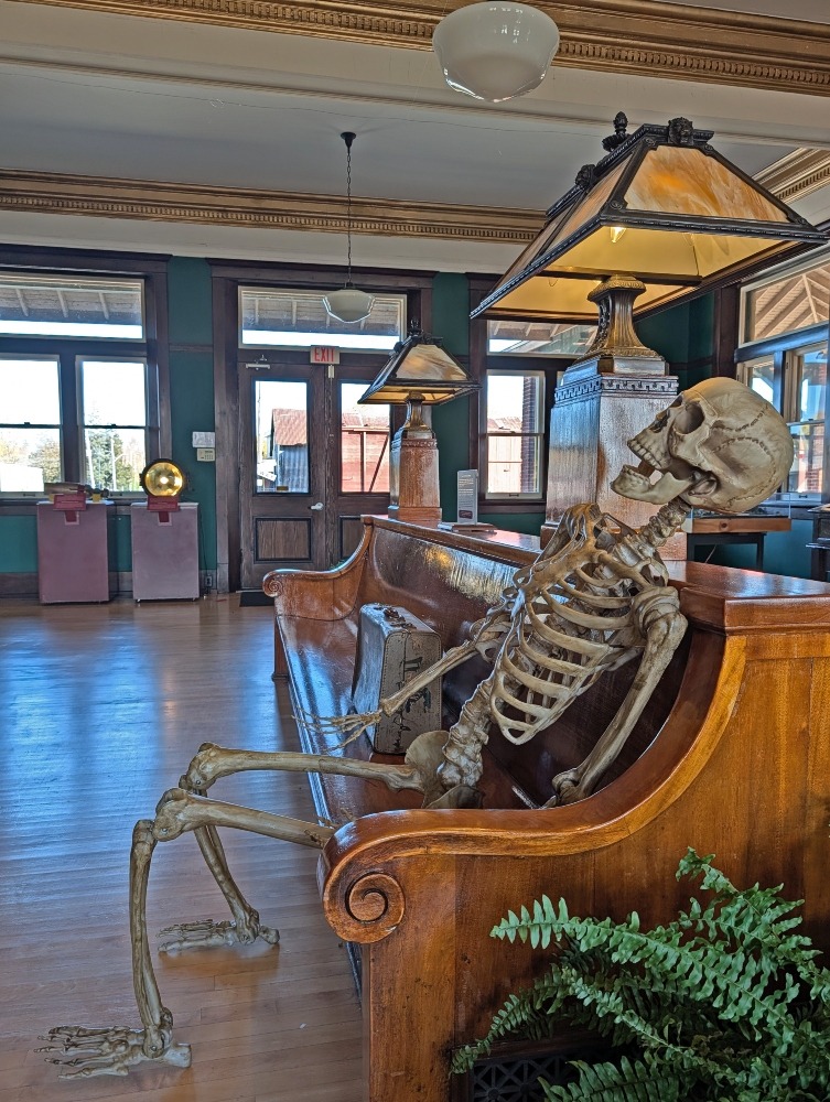 skeleton sitting on the train bench at the Railway Museum of Eastern Ontario