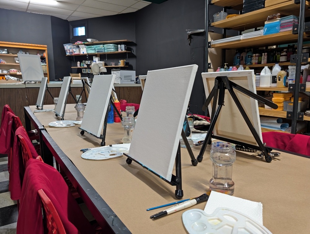 table with 8 blank paint canvases on it at the Craft Witch